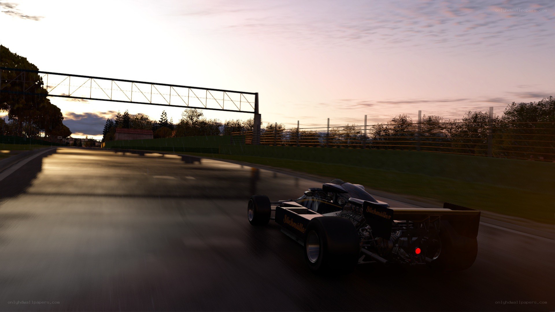 racing car on track at dusk