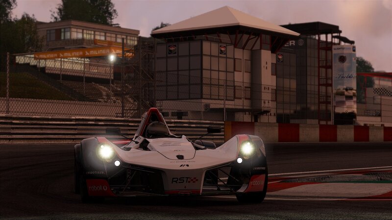 racing car on track at dusk