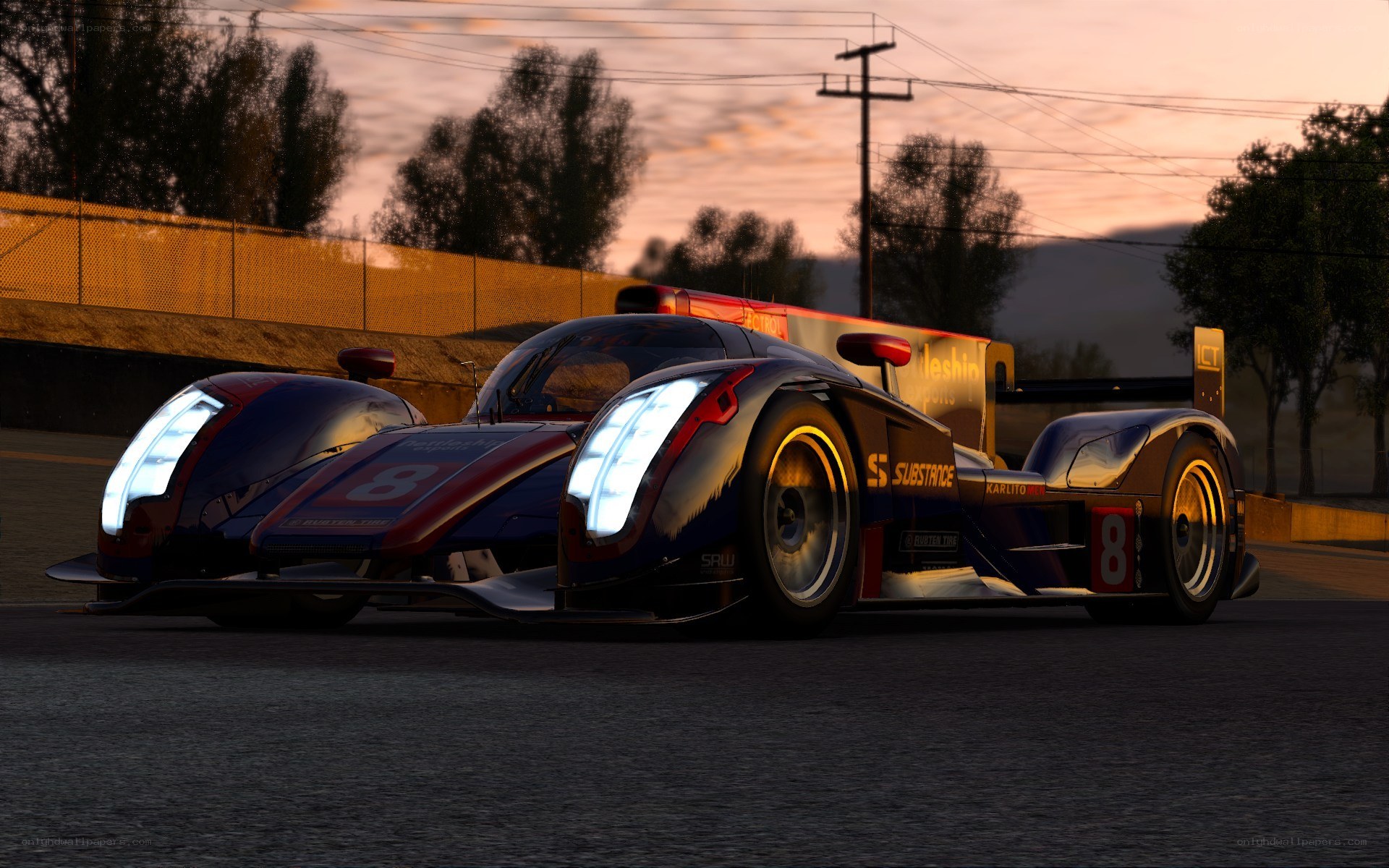 racing car on track at dusk