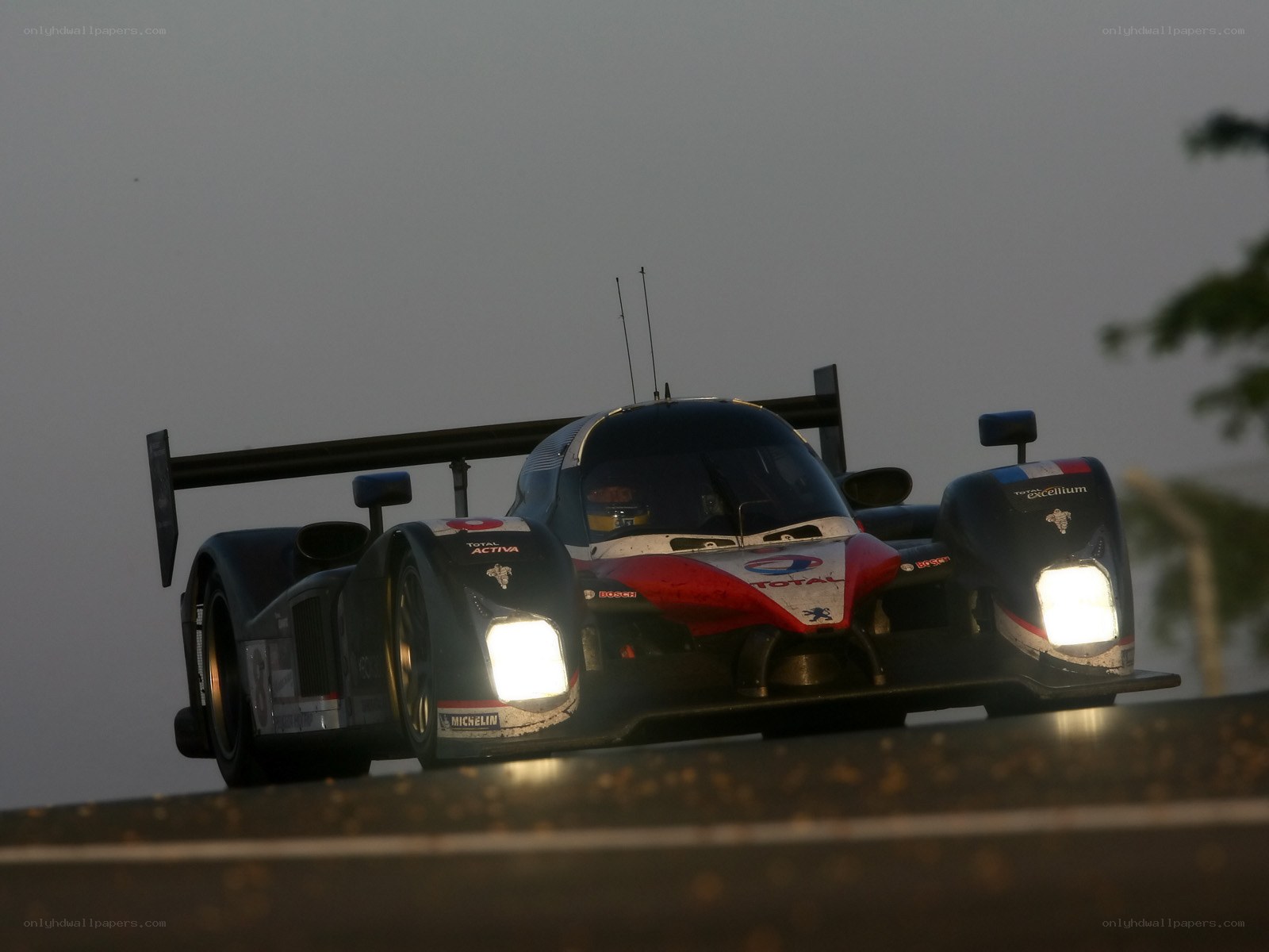 racing car on track at dusk