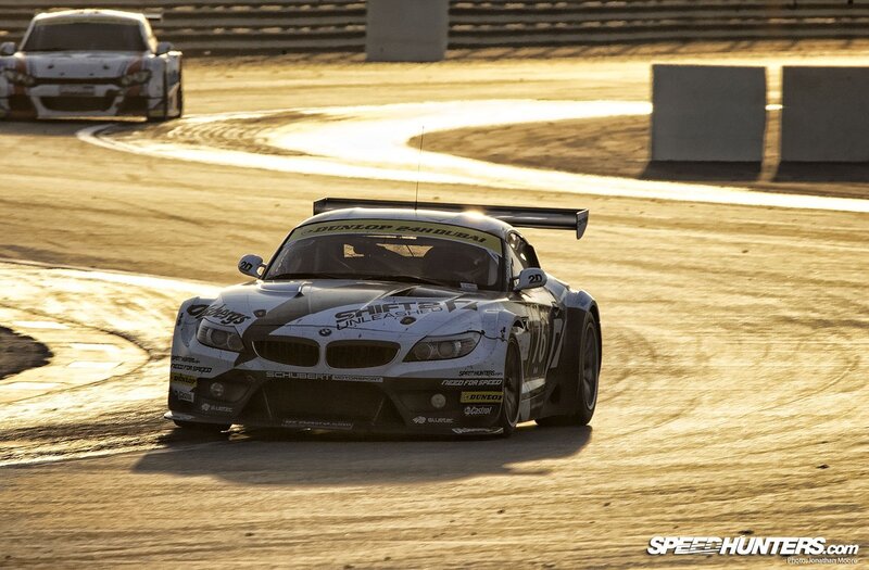 racing car on track at sunset