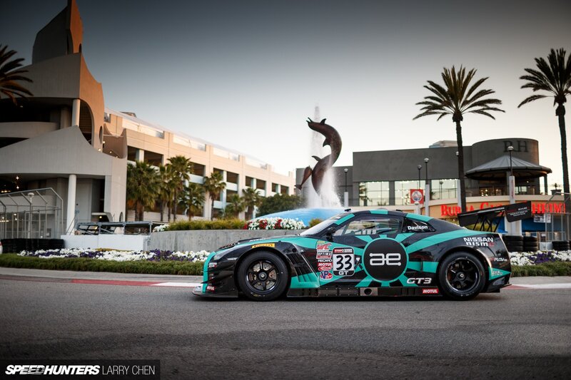 Racing Car on Track — Black, Dramatic, Sunset, Photograph, Palm Trees