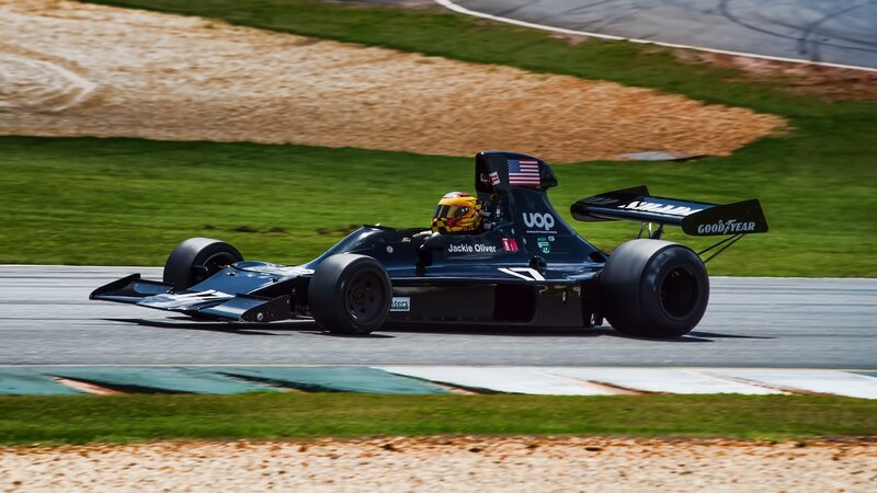 Racing Car on Track — Black, Dynamic, Afternoon, Photograph, Driver, Grass