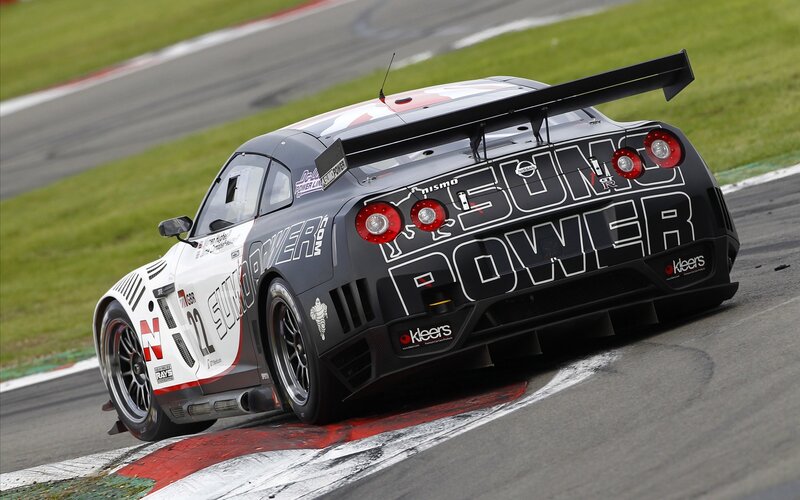 Racing Car on Track — Black, Dynamic, Afternoon, Photograph, Race Car, Grass, White