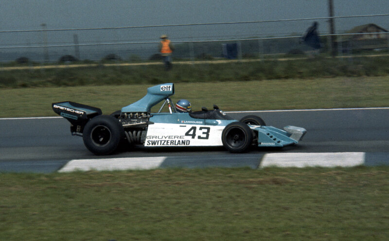 Racing Car on Track — Blue, Dynamic, Afternoon, Photograph, Driver