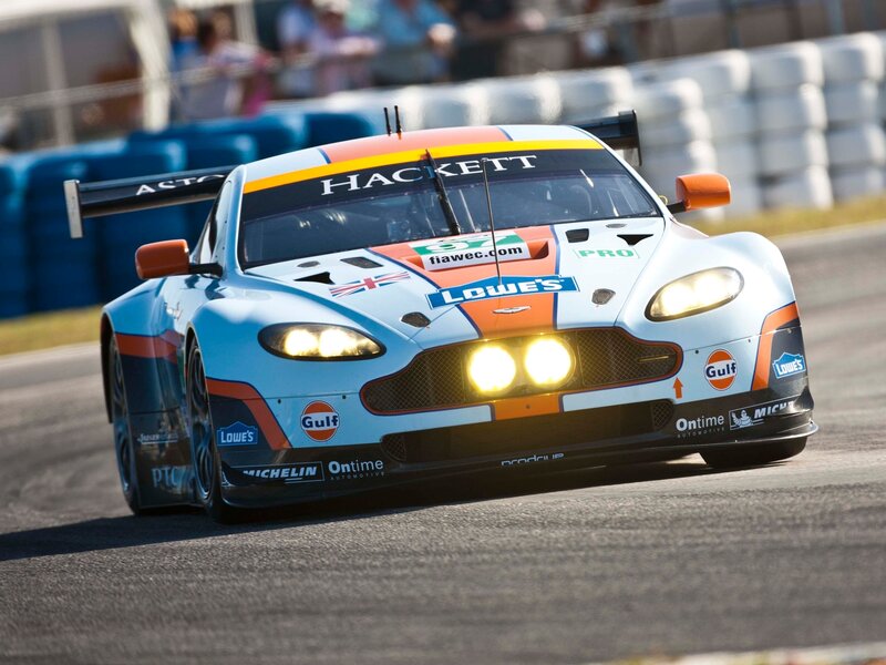 Racing Car on Track — Blue, Dynamic, Afternoon, Photograph, Race Car, Spectators