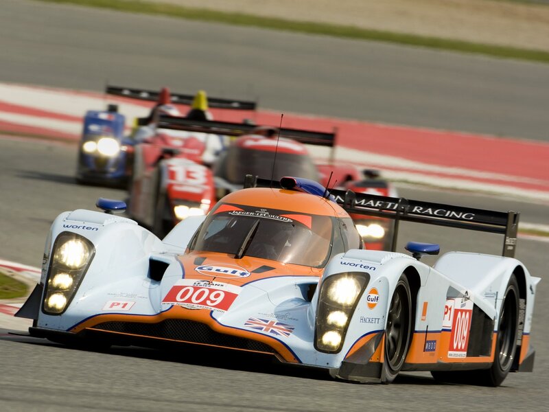 Racing Car on Track — Orange, Dynamic, Afternoon