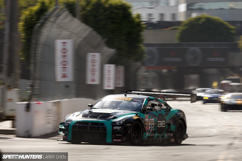 Racing Car on Track — Teal, Dynamic, Afternoon