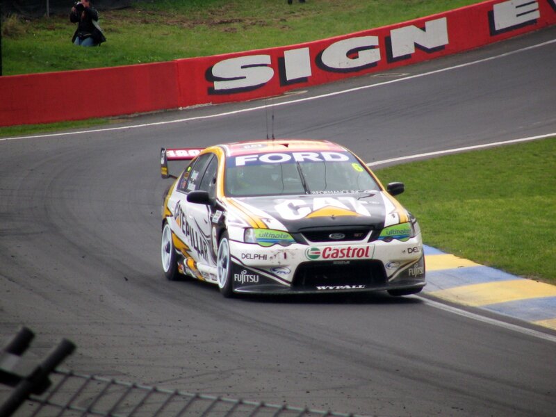 Racing Car on Track — White, Dynamic, Afternoon, Photograph, Person with Camera