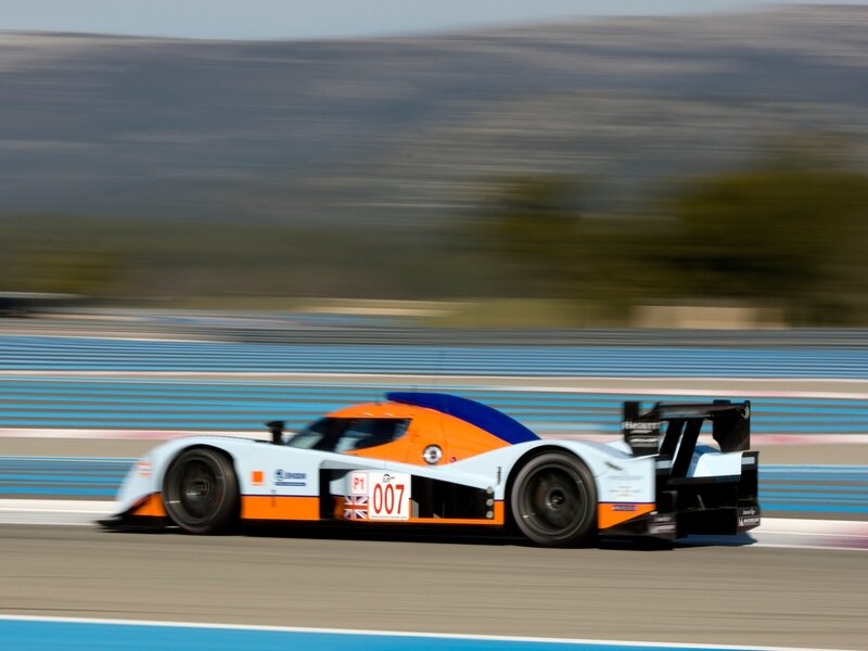 Racing Car on Track — White, Dynamic, Afternoon, Photograph, Race Car, Blurred Background
