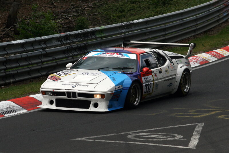 Racing Car on Track — White, Dynamic, Photograph, Race Car, Guardrail, Blue