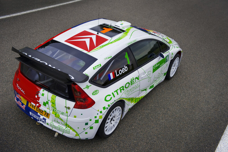 Racing Car on Track — White, Dynamic, Photograph, Race Car, Sponsor Logos