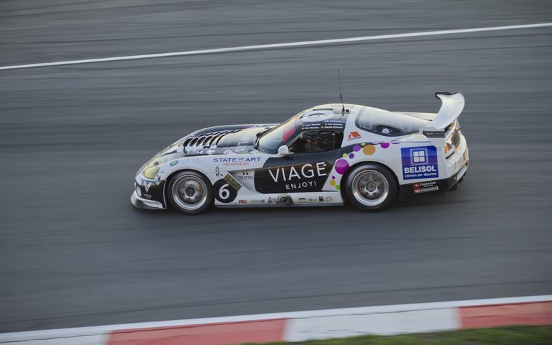 Racing Car on Track — White, Dynamic, Sunset