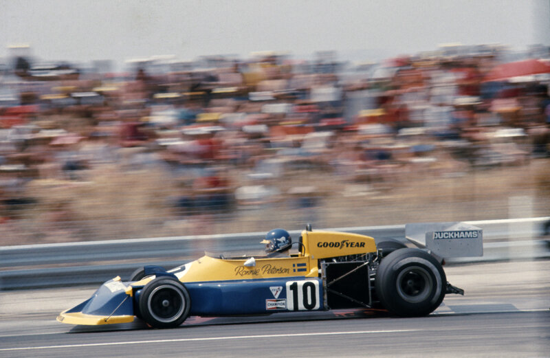 Racing Car on Track — Yellow, Dynamic, Afternoon, Photograph, Crowd