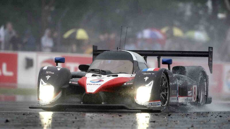 Racing Car on Wet Track — Black, Dramatic, Photograph, Rain