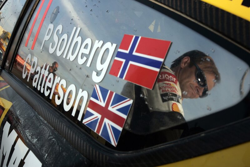 Racing car window with driver reflection