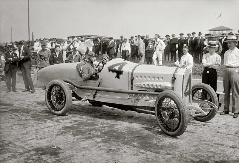 Racing car with driver and crowd