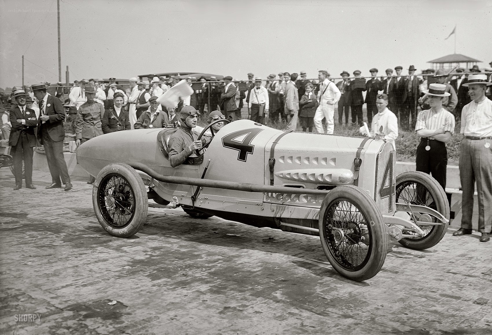 Racing car with driver and crowd