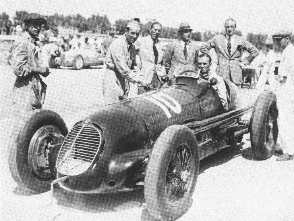 Racing car with team members