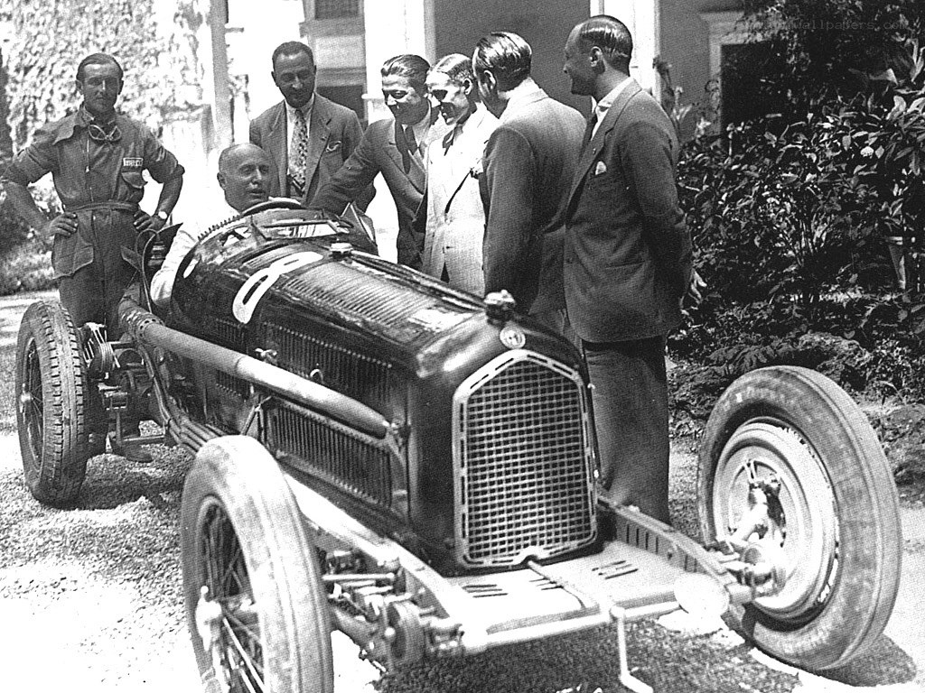 Racing car with team members