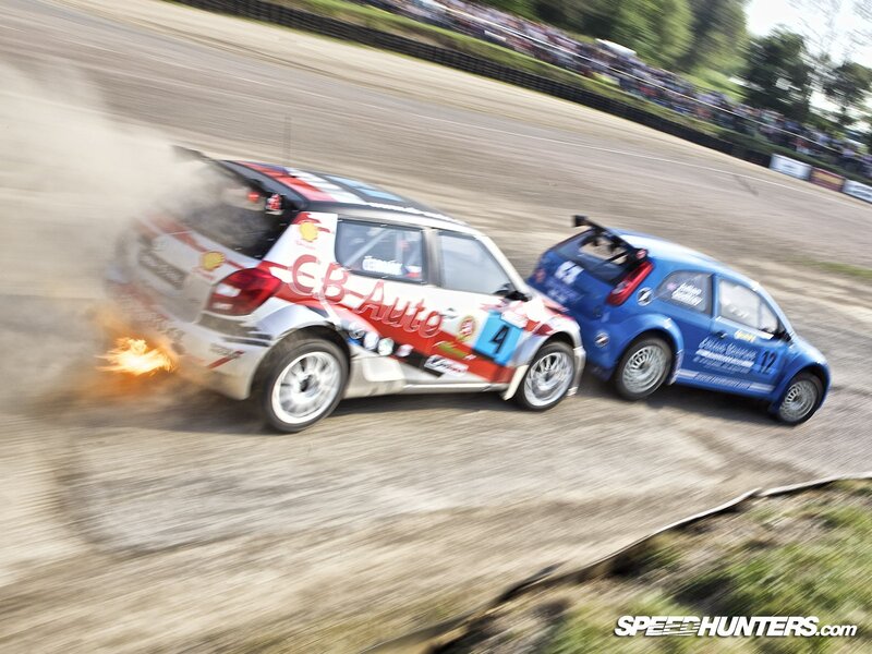 Racing cars collide on track
