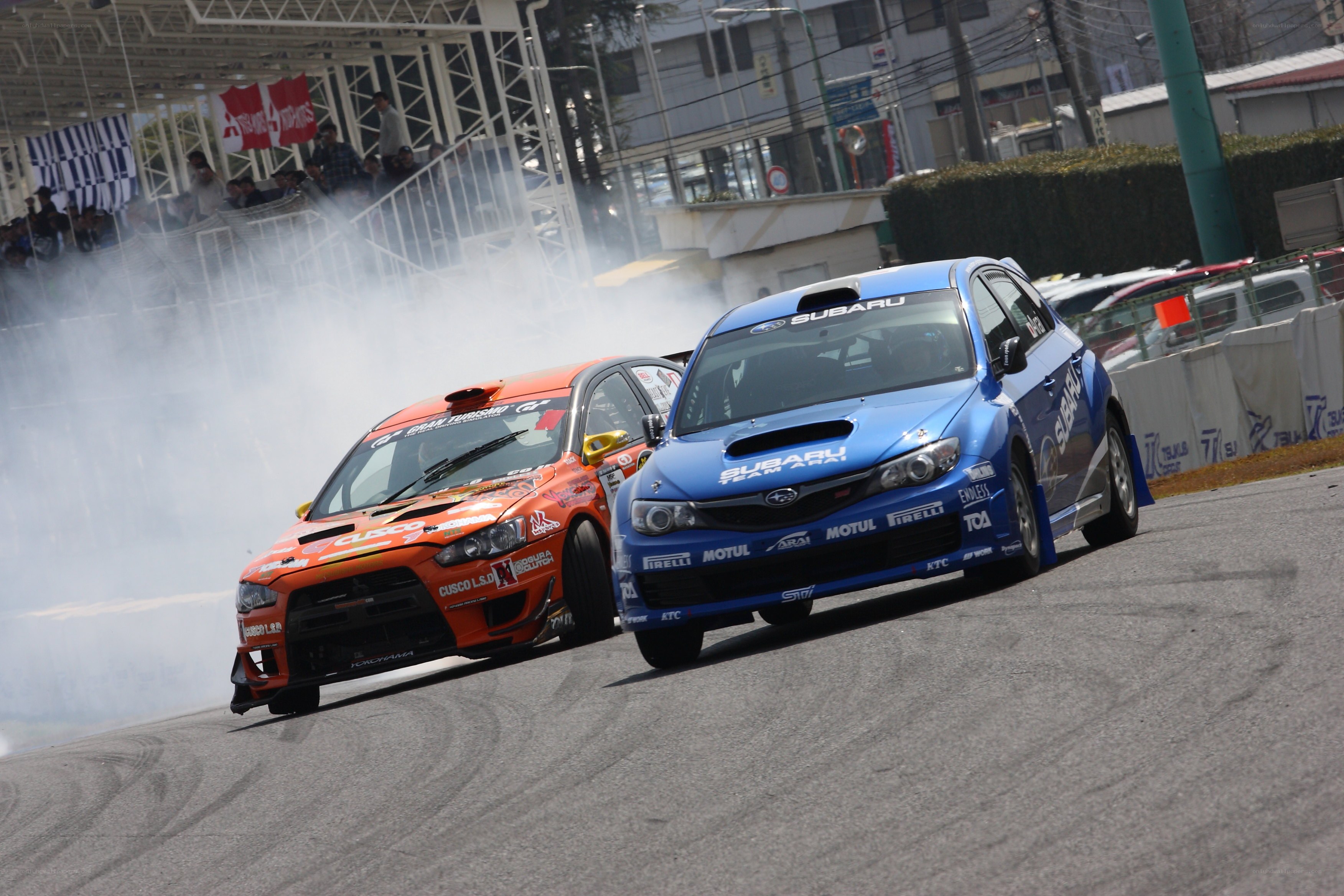 Racing cars drifting on track