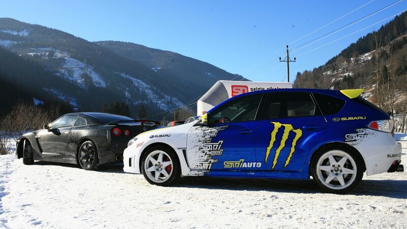 Racing cars in snowy mountains