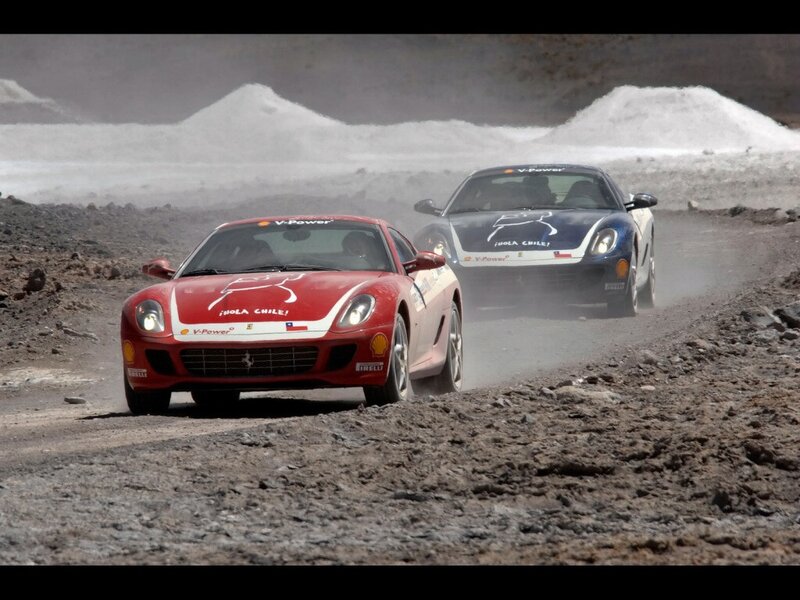 Racing cars on a dusty track