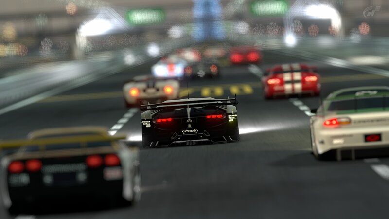 racing cars on a wet track