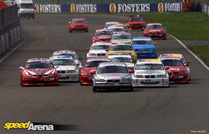 Racing Cars on Track — Red, Competitive, Afternoon, Photograph, Grass