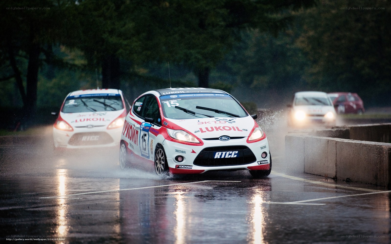 Racing cars on wet track