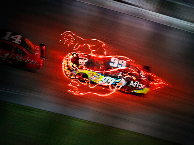 racing cars with light trails