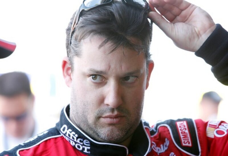 racing driver adjusting sunglasses