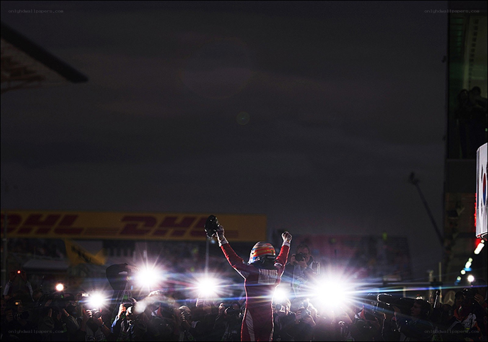 racing driver celebrates victory