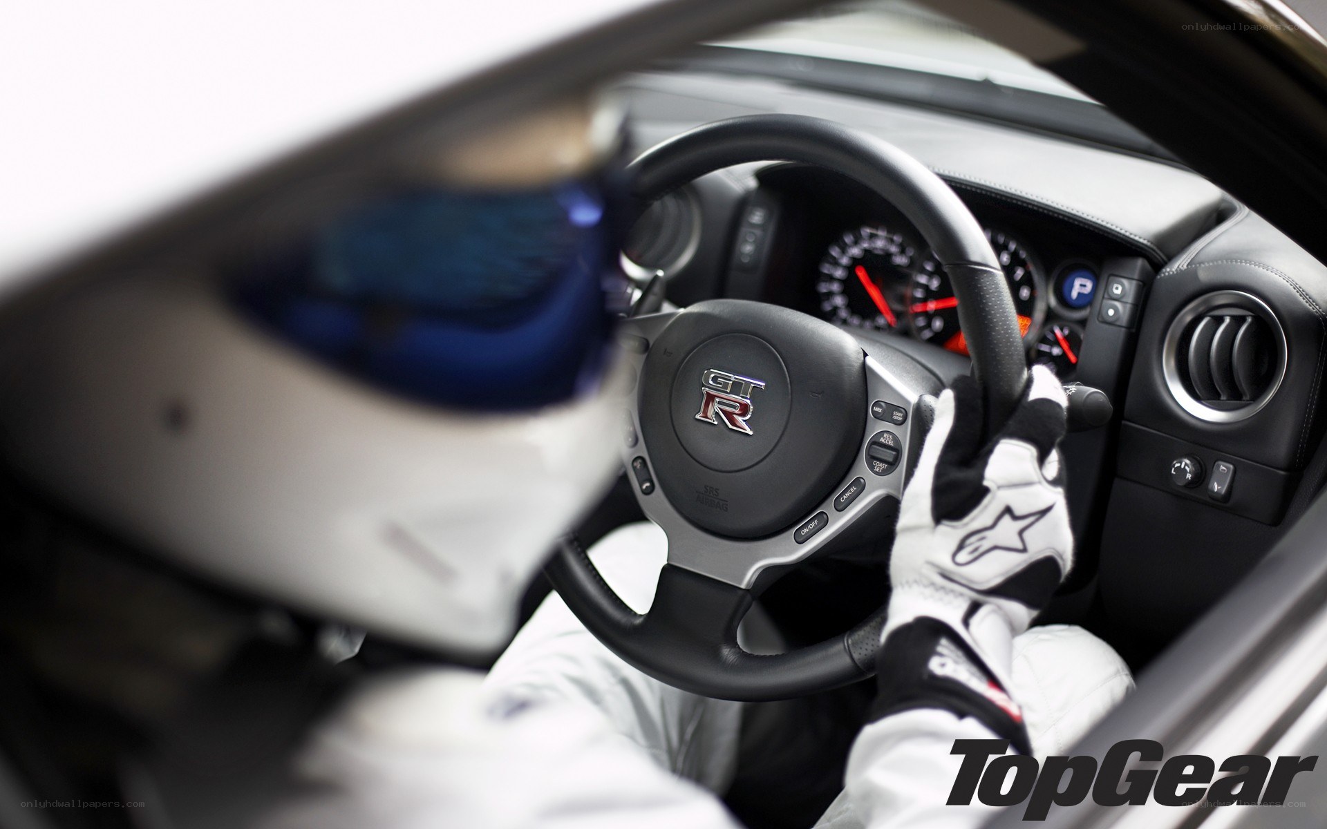 racing driver in car cockpit