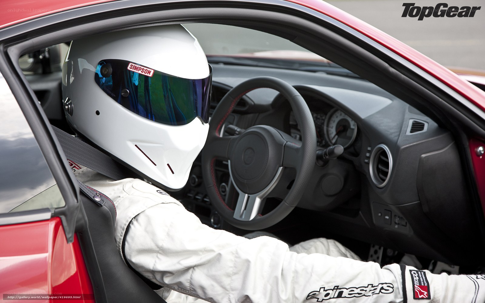 racing driver in car cockpit