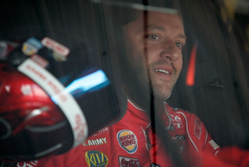 Racing Driver in Car — Red, Focused, Photograph, Helmet, Car Interior