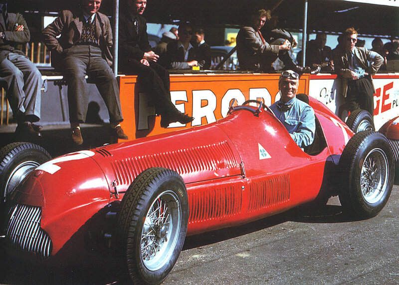 Racing driver in red car