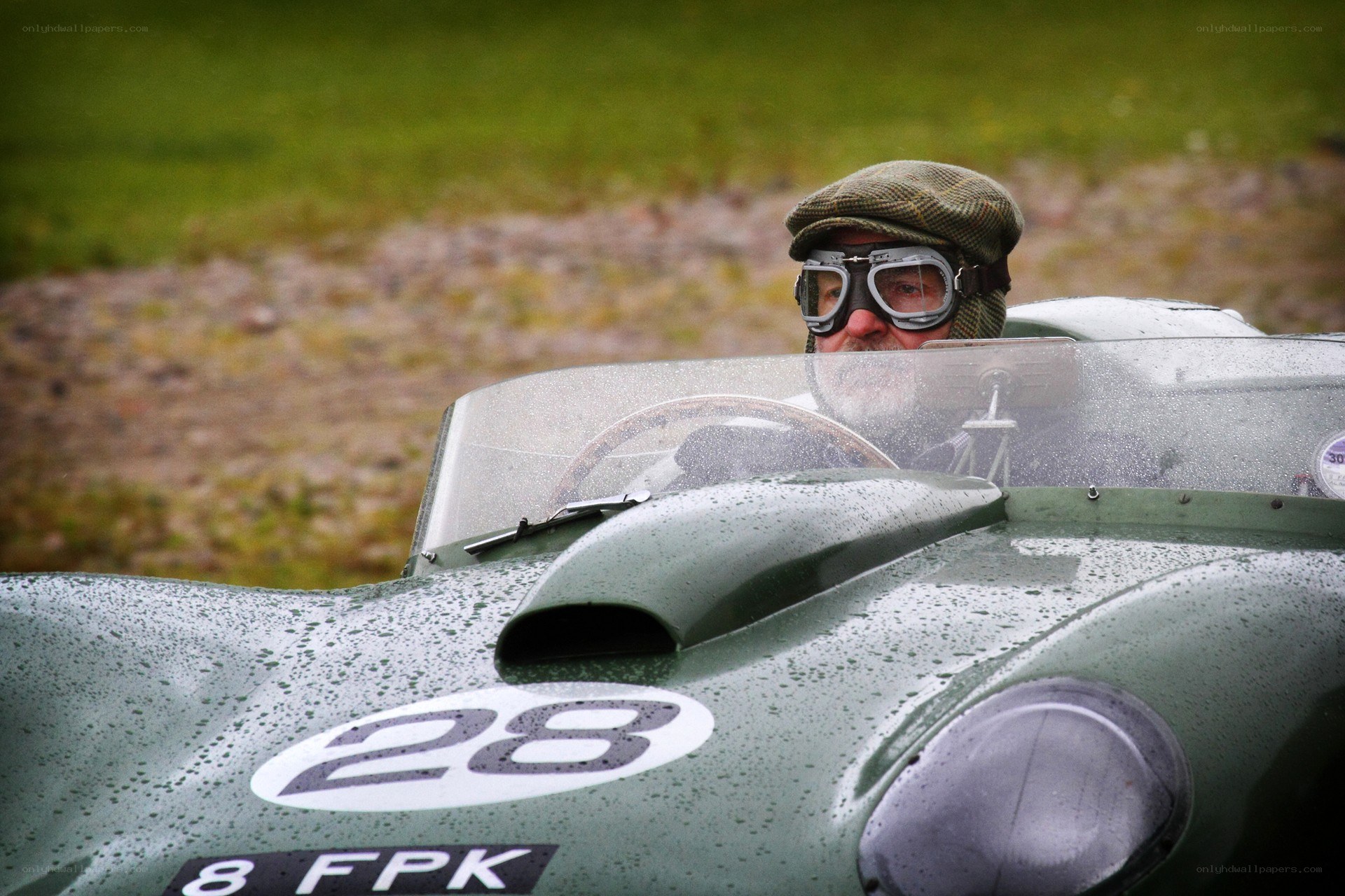 Racing driver in vintage car