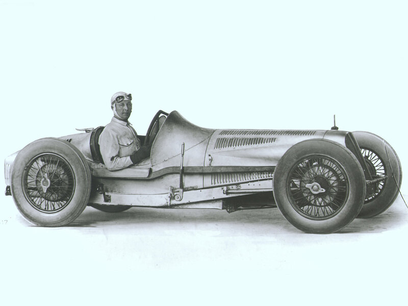 Racing driver in vintage car