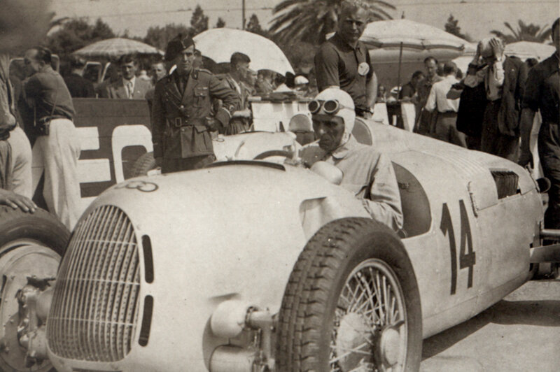 Racing driver in vintage car