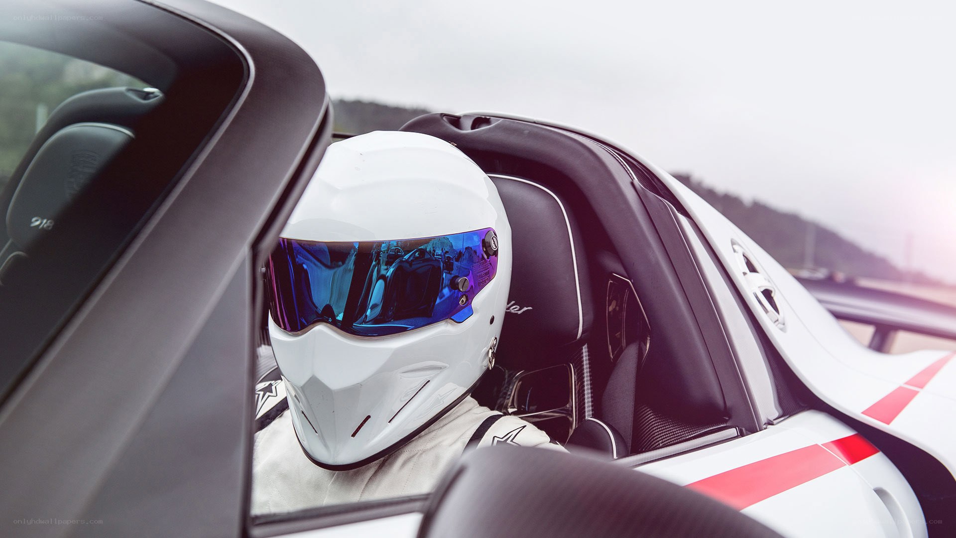 racing driver in white helmet