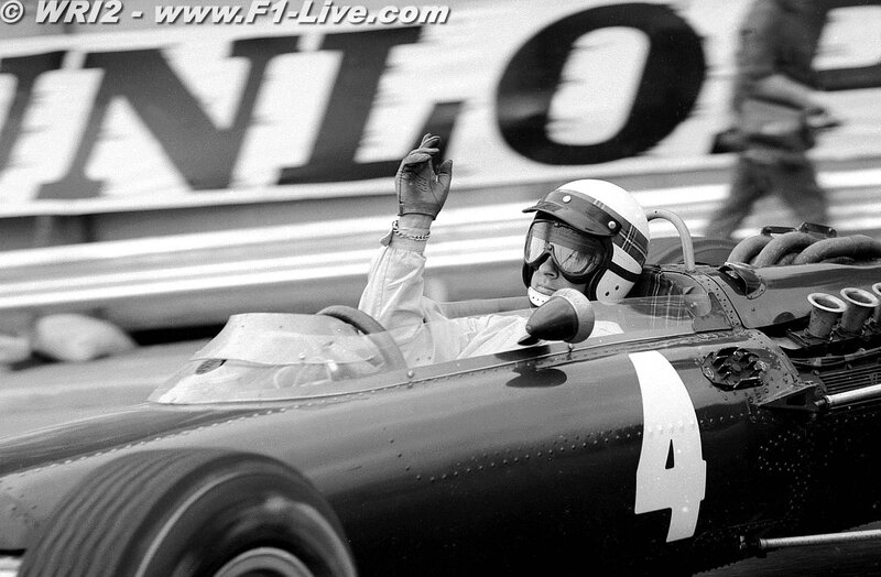 racing driver waving from car