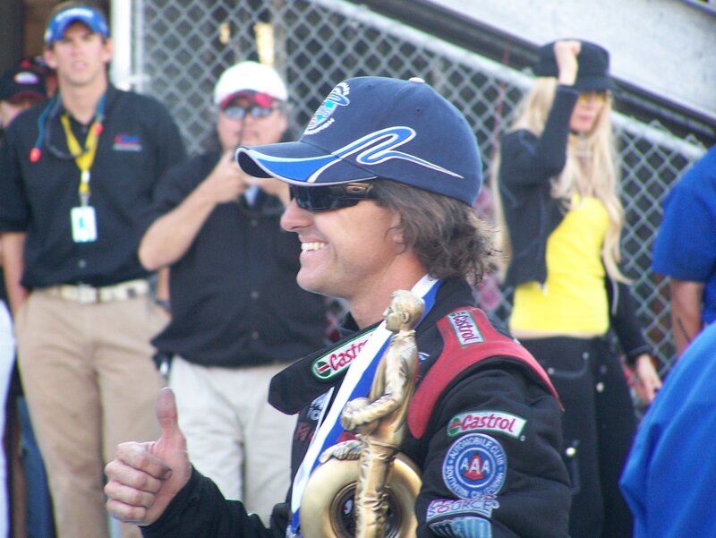 racing driver with trophy