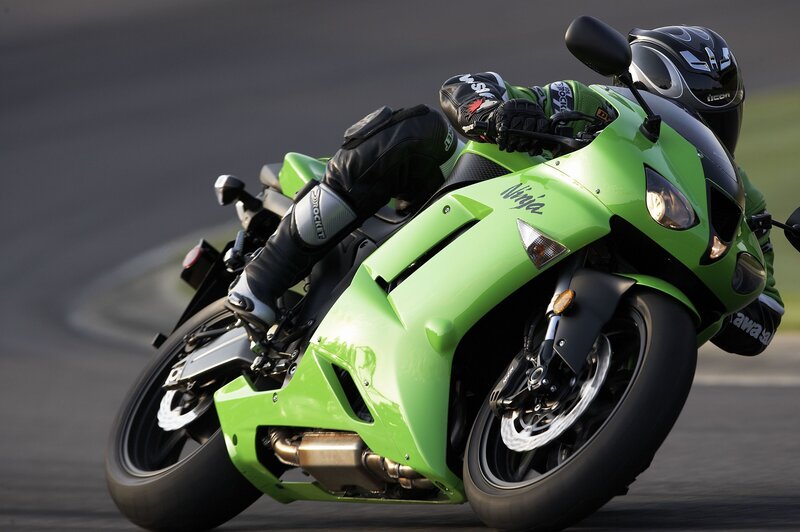 racing green motorcycle on track
