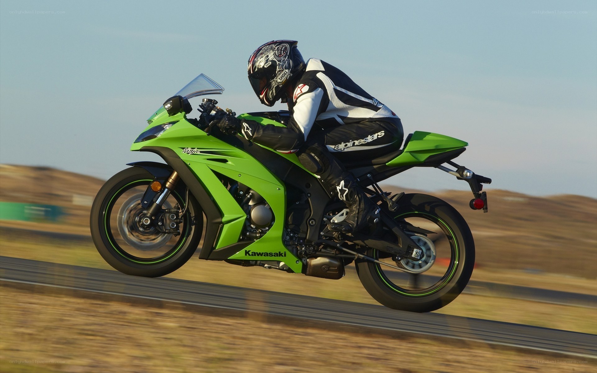 Racing green motorcycle on track