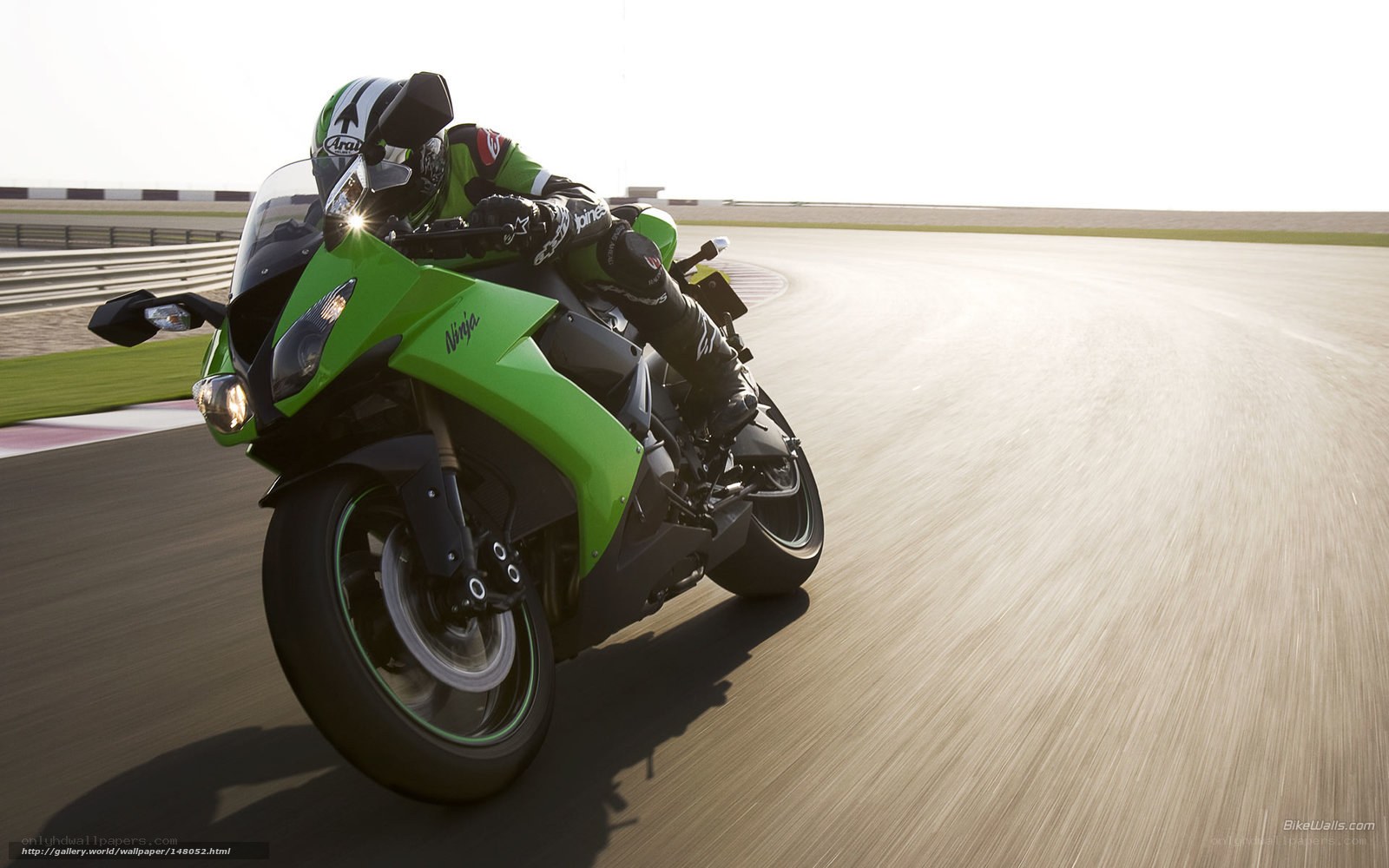 racing green motorcycle on track