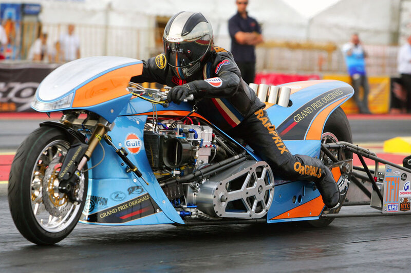 Racing Motorcycle on Track — Blue, Dynamic, Afternoon, Photograph, Rider, Spectators