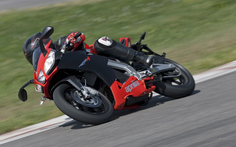 Racing Motorcycle on Track — Red, Dynamic, Afternoon, Photograph, Rider, Black