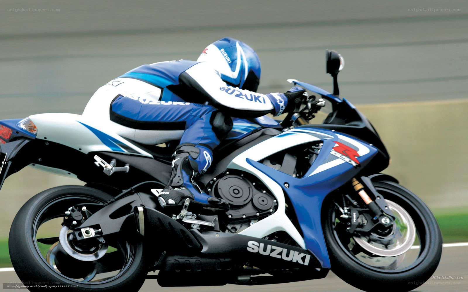 racing on a blue suzuki